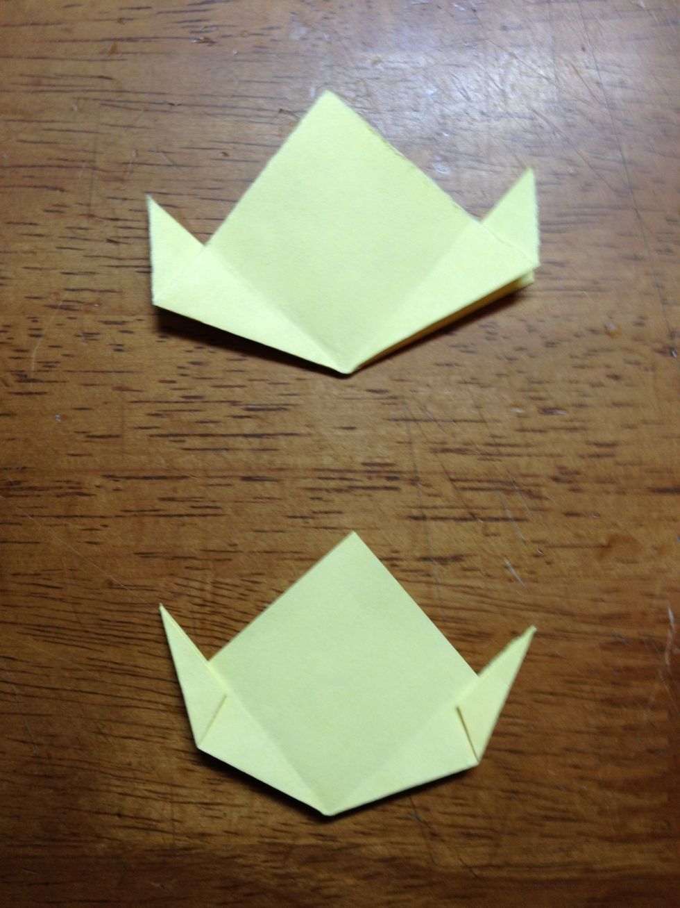 Next, fold the in the out flaps toward the middle (where you had folded that flap in half) on both sides so that it looks like the bottom model.