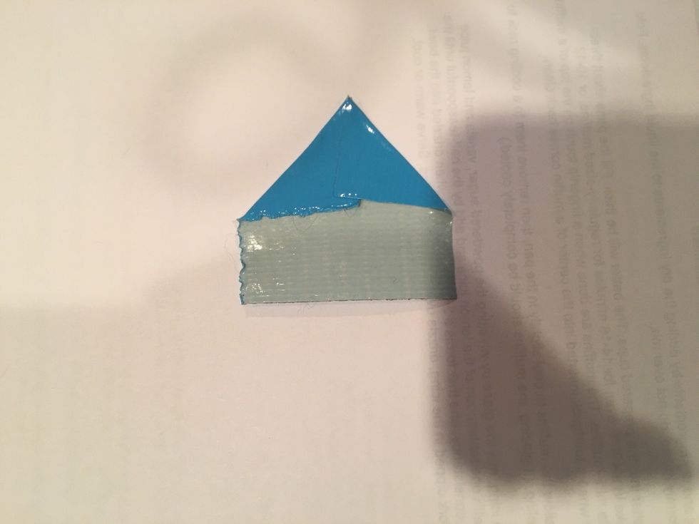 next fold the other corner down to make a triangle at the top of your square of duct tape  (it doesn't have to be perfectly even)