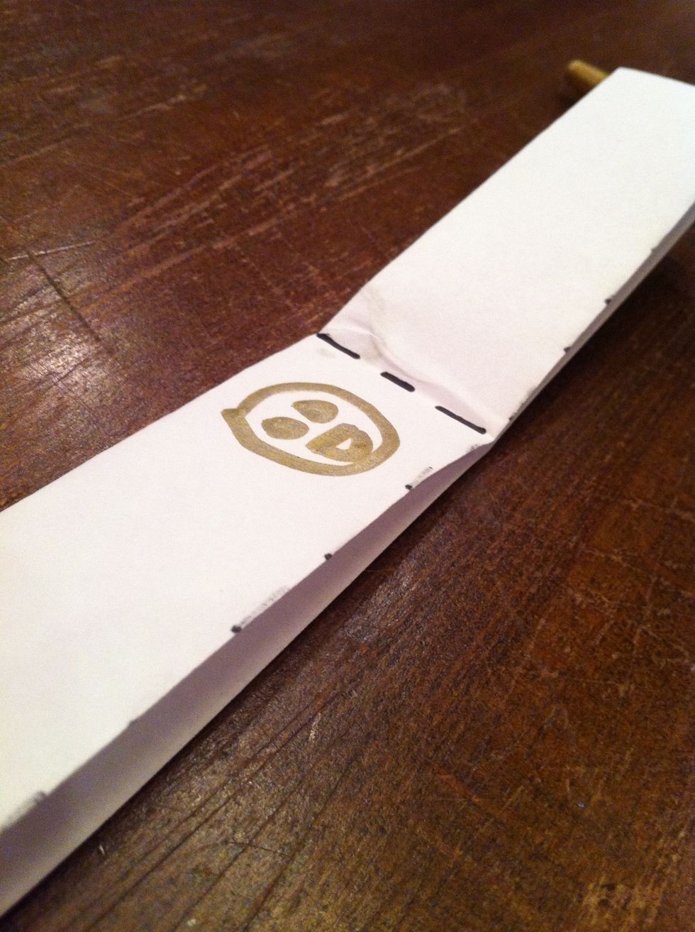 Next, fold the two vertical strips horizontally and unfold.