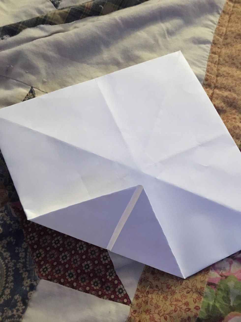 Next fold these corners in
