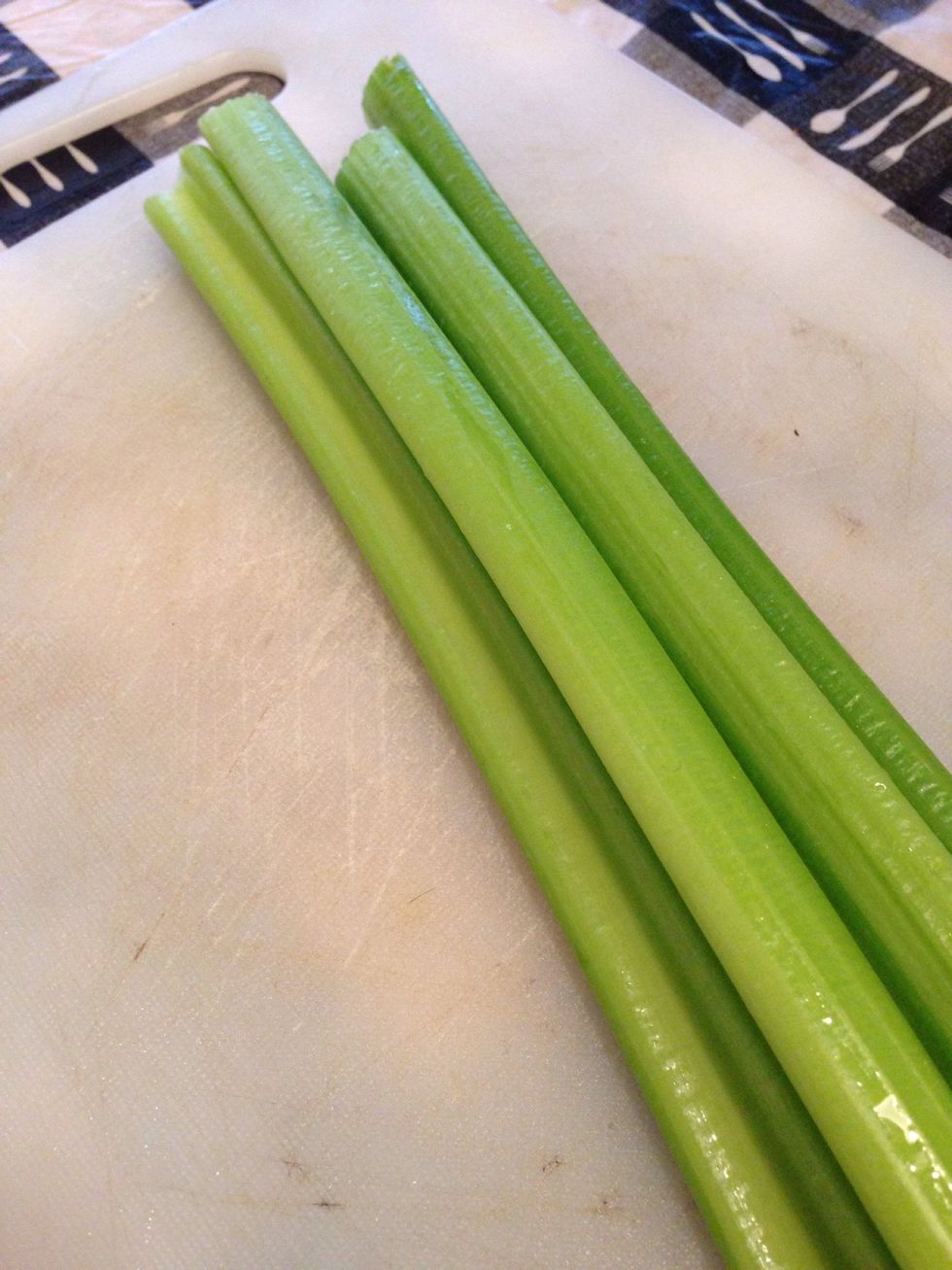 Next, gather your celery sticks. Rinse them and cut them to freshness.