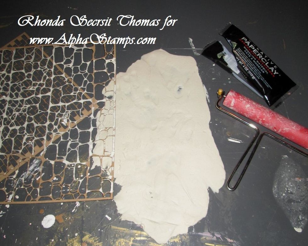 Next, gently place a Stone Wall Chipboard Texture Sheet or Brick Wall Chipboard Texture Sheet on top of the PaperClay.