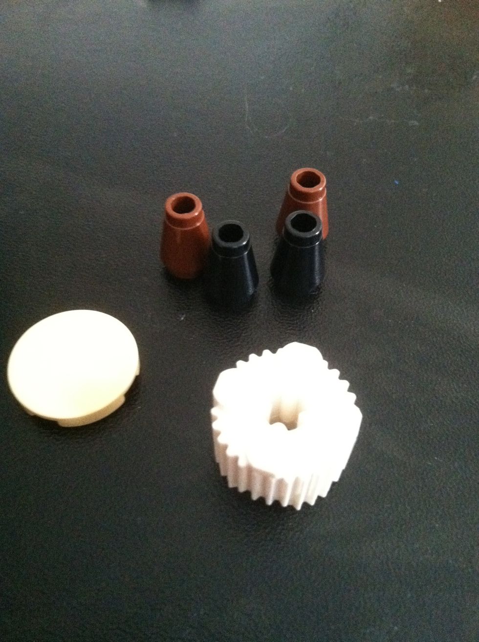 Next get a white cirlce piece, smooth tan piece, and 4 triangle pieces