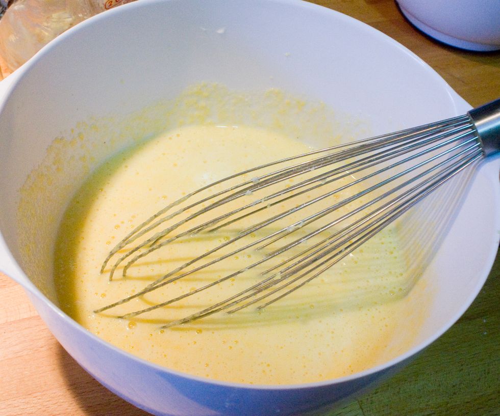Next get another bowl and gather your wet ingredients and put 1 teaspoon of vanilla, 1 egg, 1 3-ounce package of softened cream cheese and 1 cup of softened butter. Mix well.