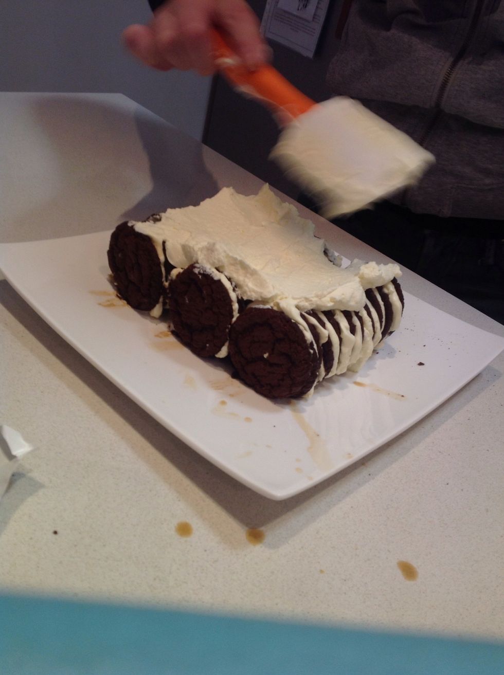 Next get the cream thats left and spread all over the biscuits