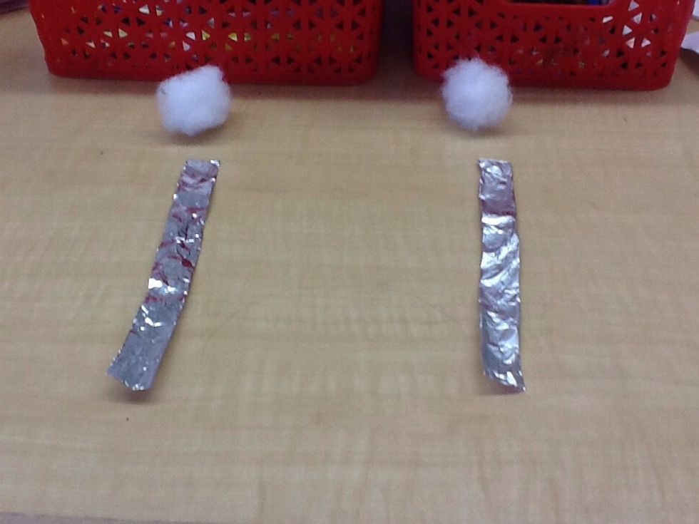 Next get two puffballs, two pieces of tinfoil and two pieces of tape.