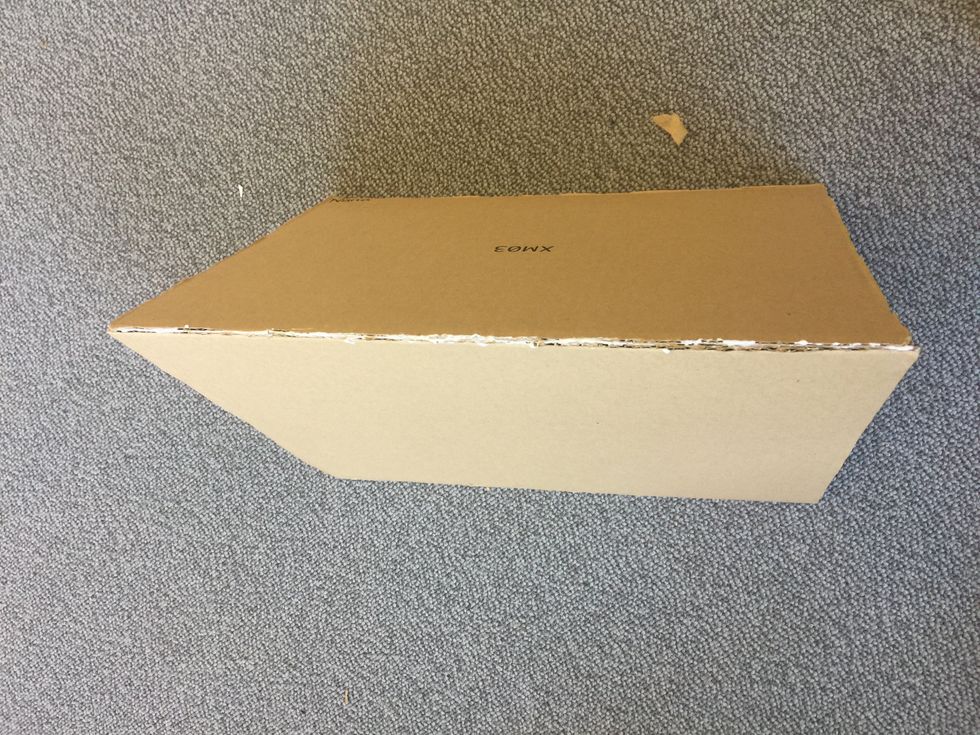 Next, glue together the 32cm side of the two largest pieces of cardboard.