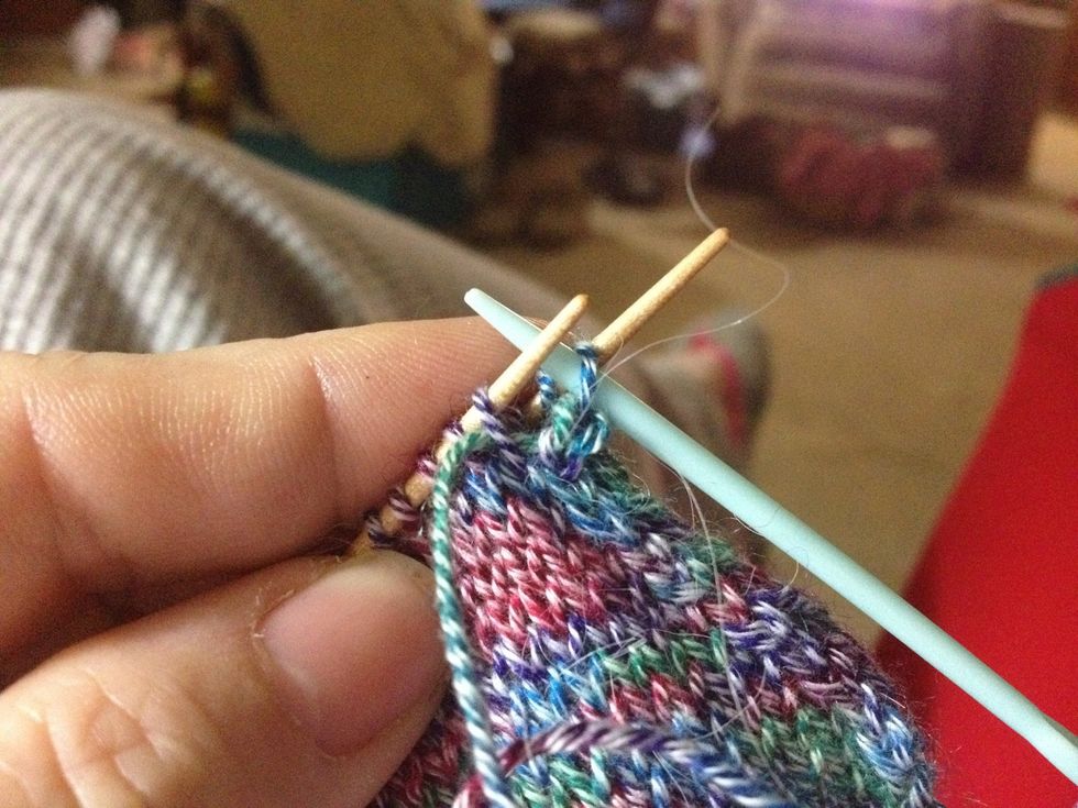 Next go purlwise through the 1st stitch on back needle. Pull yarn through, as always not too tightly. You can snug up all the stitches when you finish grafting.