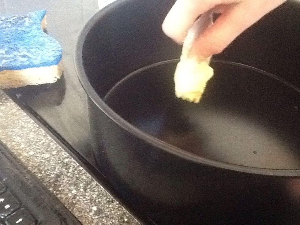 Next grab a piece of butter and place in the baking tin