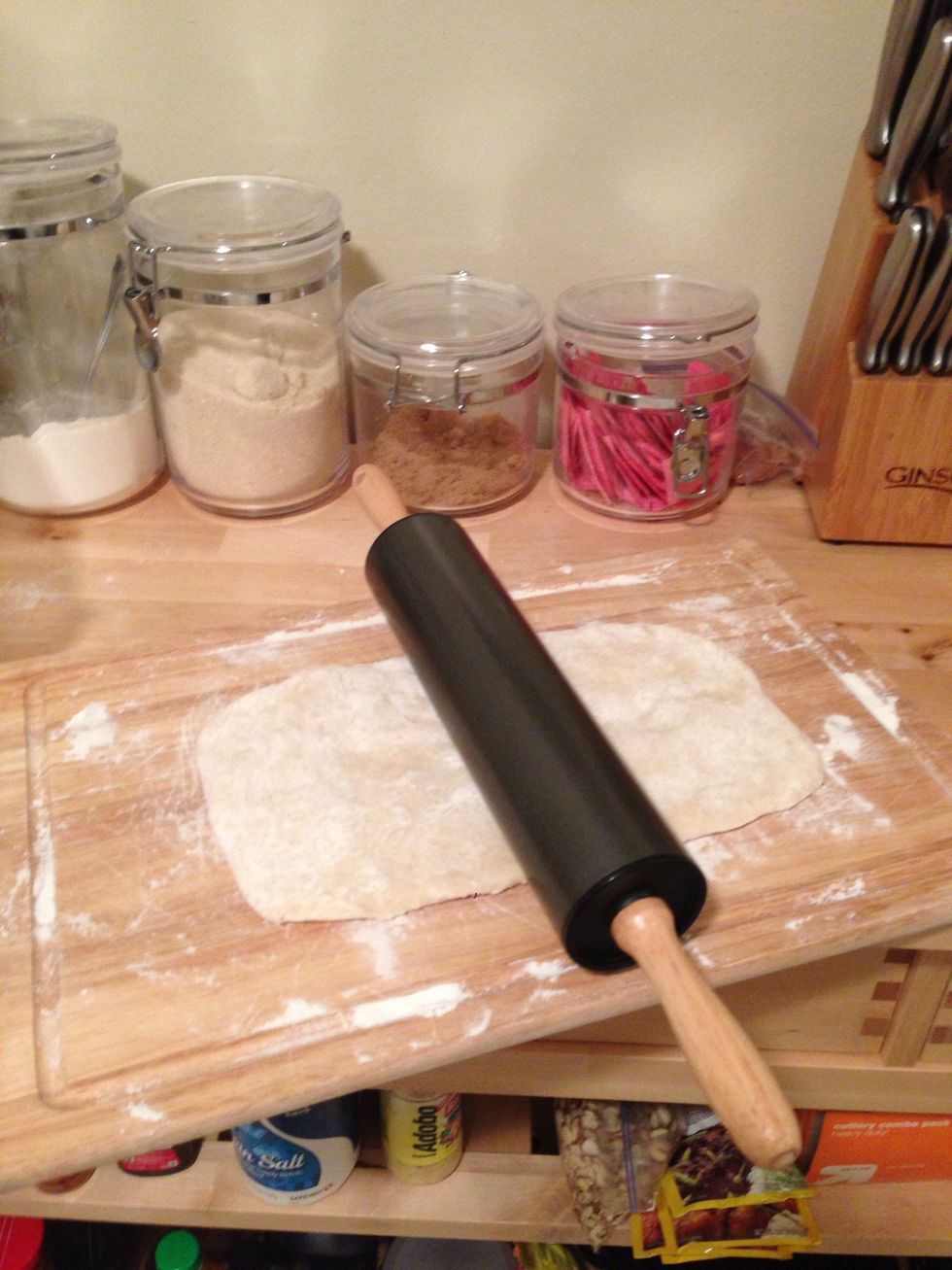 Next, grab a rolling pin and roll the dough to about 1/8". Try to make it as rectangular as possible.