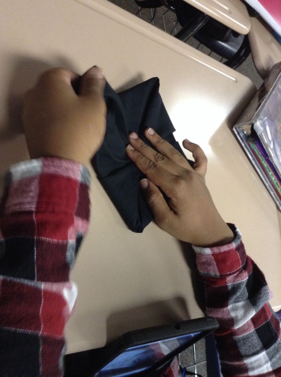 Next, grab the bottom fold and pull
