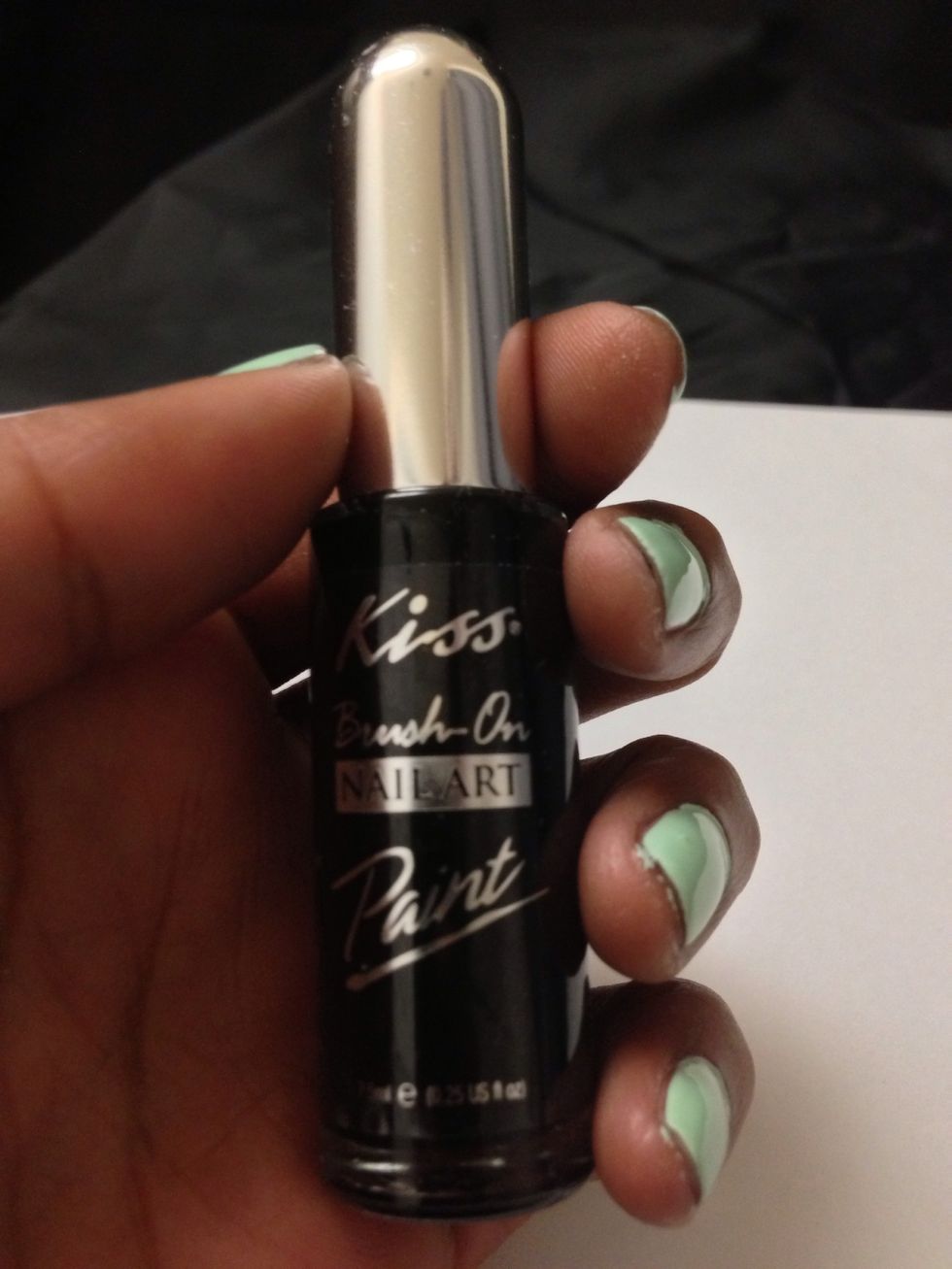 Next grab your black nail art pen or paint. I'm using Kiss Brush On Nail Art Paint in Black. Using sweeping motions, draw branches on each nail.