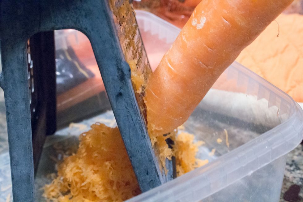 Next grate 2 cups worth of carrots.