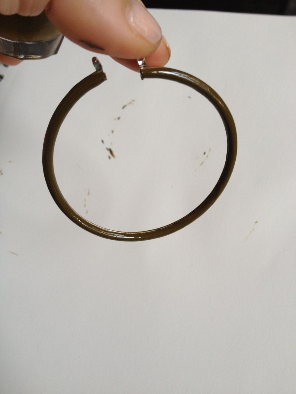 Next hold Earring by stem and paint all the areas missed