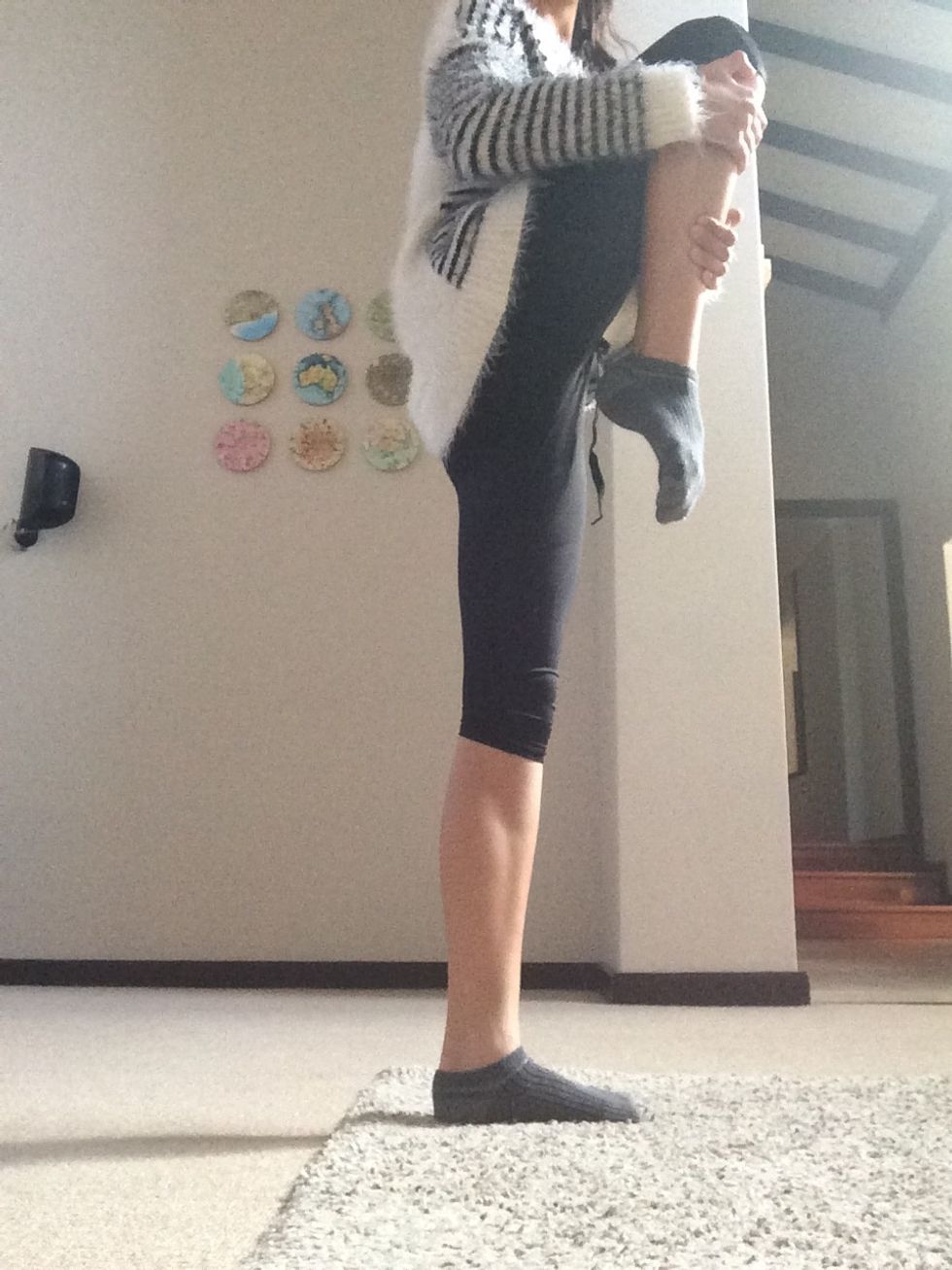 Next, hold your knee against your chest to stretch your hamstring.