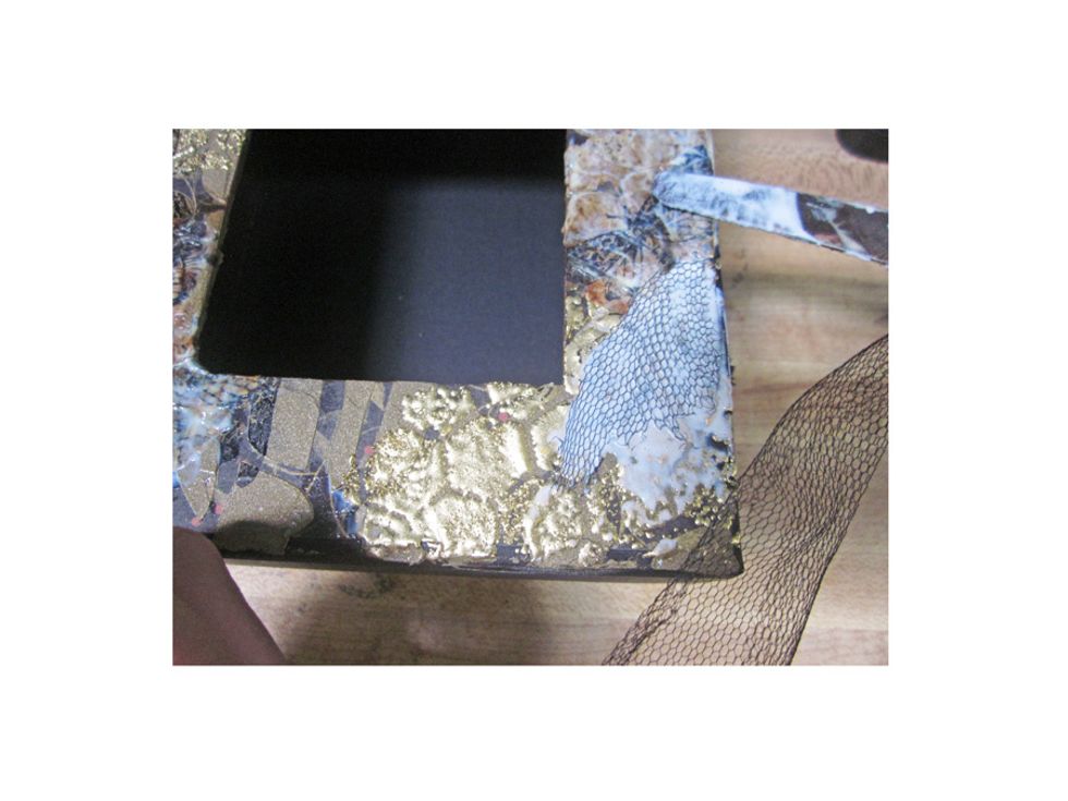 Next I added in some ripped little bits of netting to my mixed media piece. Again just set it with the Matte Medium and leave to dry. You can hurry the drying along with a heat gun if you'd like.