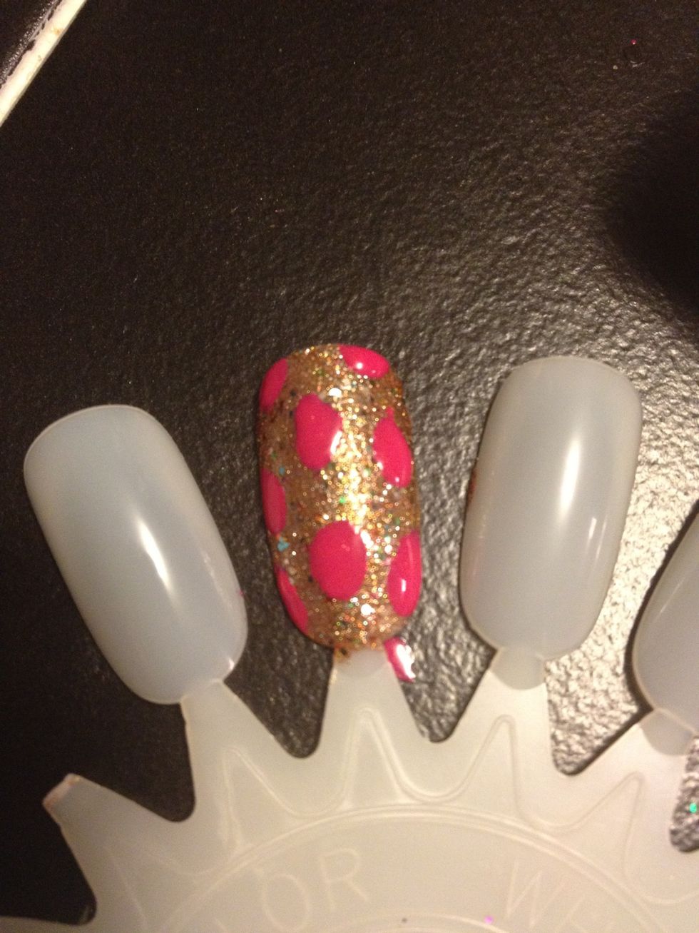 Next I added Twisted Pink by Sally Hansen Xtreme wear. You add the print by using a dotting tool or the brush itself, they don't need to be perfect circles.