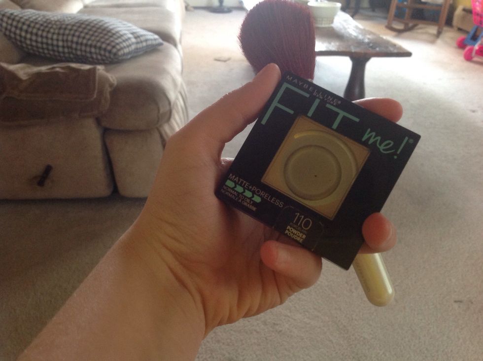 Next I am using my powder foundation and putting that all over my face also. I am using my elf face brush