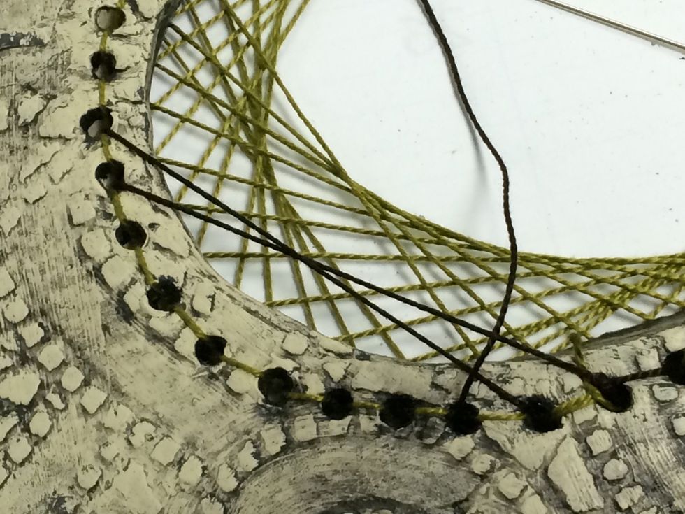 Next I am working another color line design of the front side of the loom. I am skipping fewer holes to create a thinner line disign.