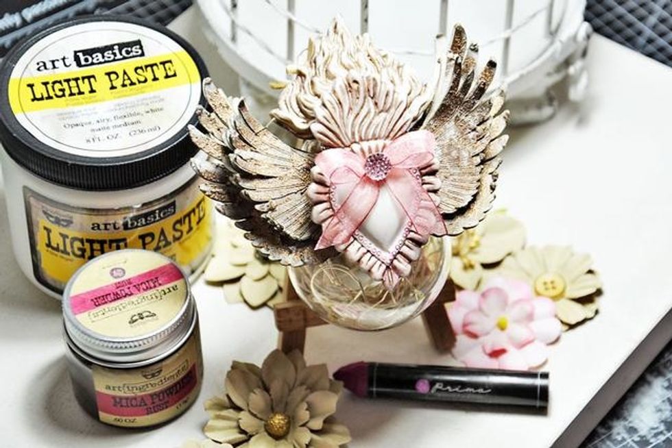 Next I attached my bulb to an R&A small wooden easel, then decorated it with ribbon and a crystal. Tuck a short set of Prima Lumies inside the bulb leaving the switch accessible.