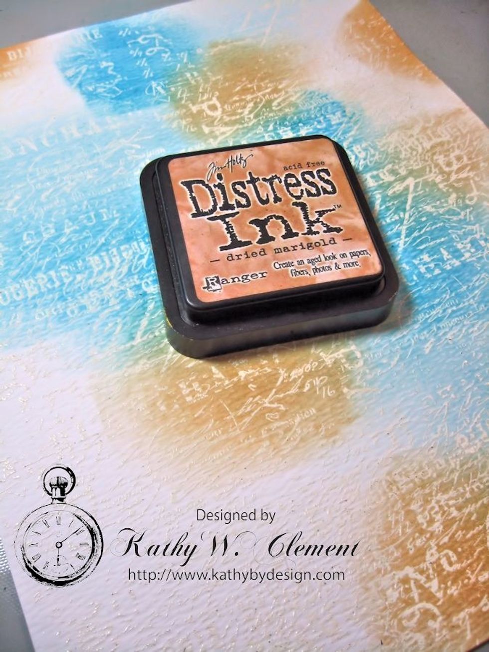 Next I chose to work with Dried Marigold. See how I am overlapping, laying the colors down next to one another? These will all blend together later on. Sponge away!