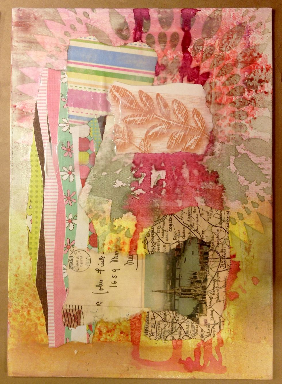 Next, I collaged some papers randomly onto the canvas.