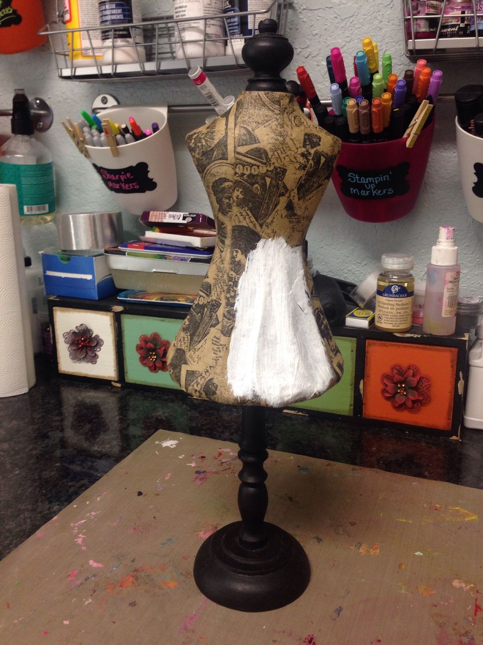 Next I covered the entire torso area with white gesso. This is to cover the old color and help the new paint color stick.