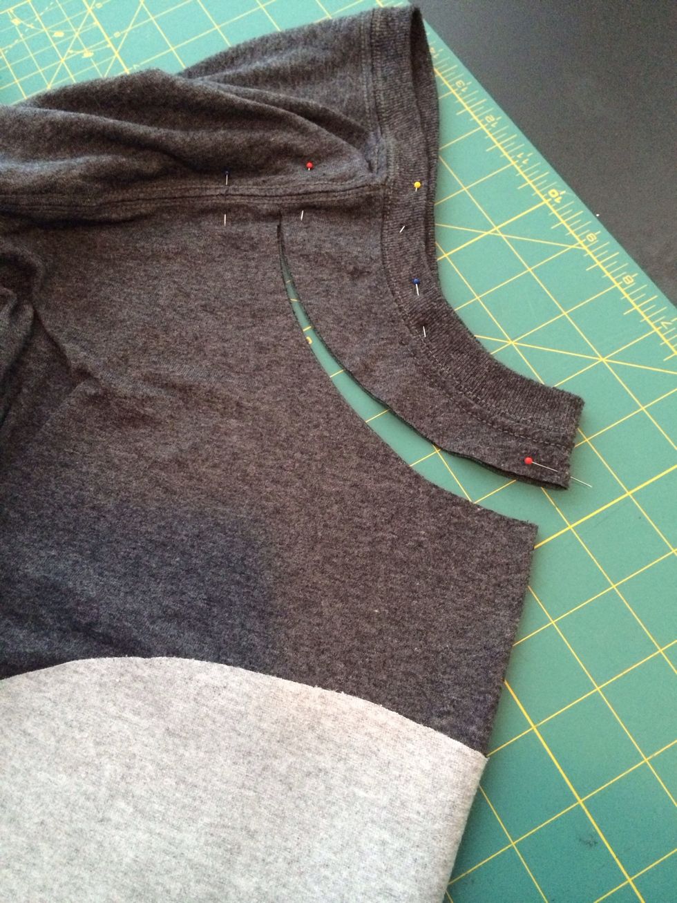 Next, I cut out the neck and sleeves. It's important to cut the front of the neck seperate from the back for better fit. Fold the front together and cut, then flip and repeat on back.