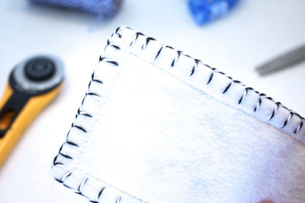 Next I did a machine straight stitch on the very inside of my blanket stitch- sorry my pic is overexposed!