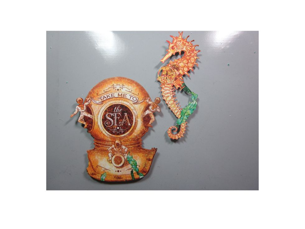 Next I fussy cut out several more of the decorative images. You can use scissors and then also an X-acto tool to get in those tight areas.