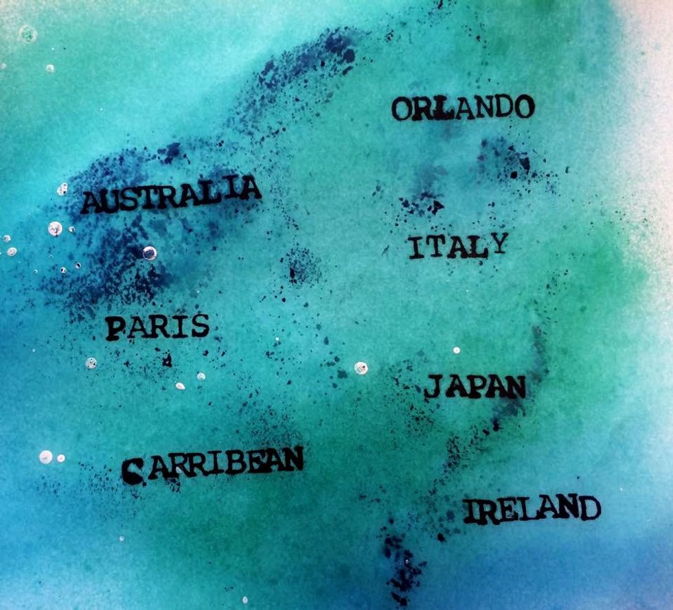 Next I misted some white cardstock with Waimea Bay and Studio Blue. That darker blue came up off of my matt from the paints. I stamped my bucket list destinations and cut them out and glued them on.