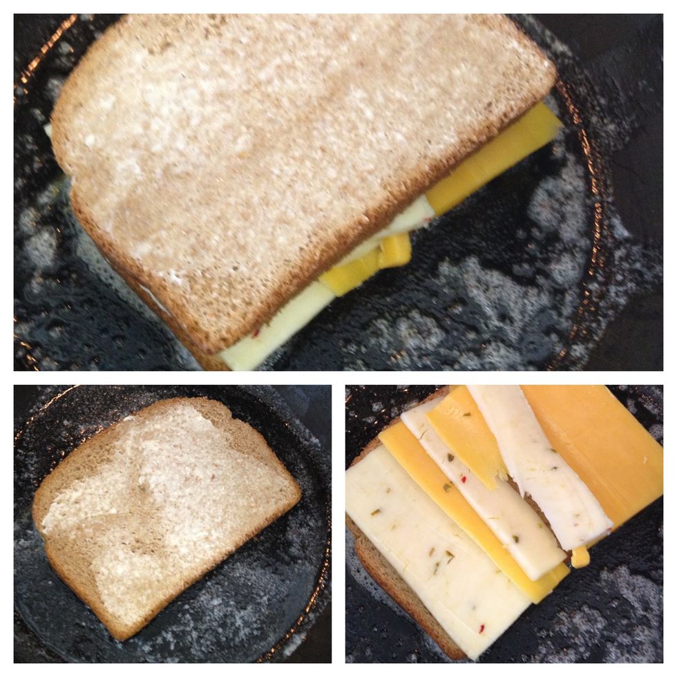 next, I place the pan on the stove top, medium low heat. I add a little bit more butter, than place the first piece of bread into the pan. the cheese and the second piece of bread follow.