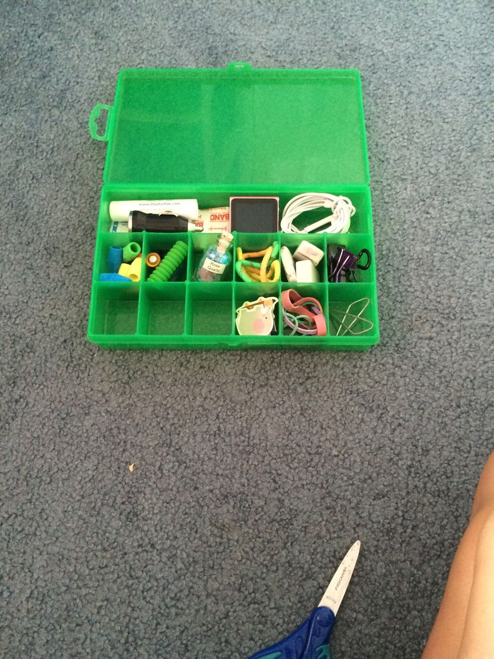 Next I put in some paperclips, rubberbands, magnetic bookmarks, a charger, and my Ipod nano \ud83c\udfa7