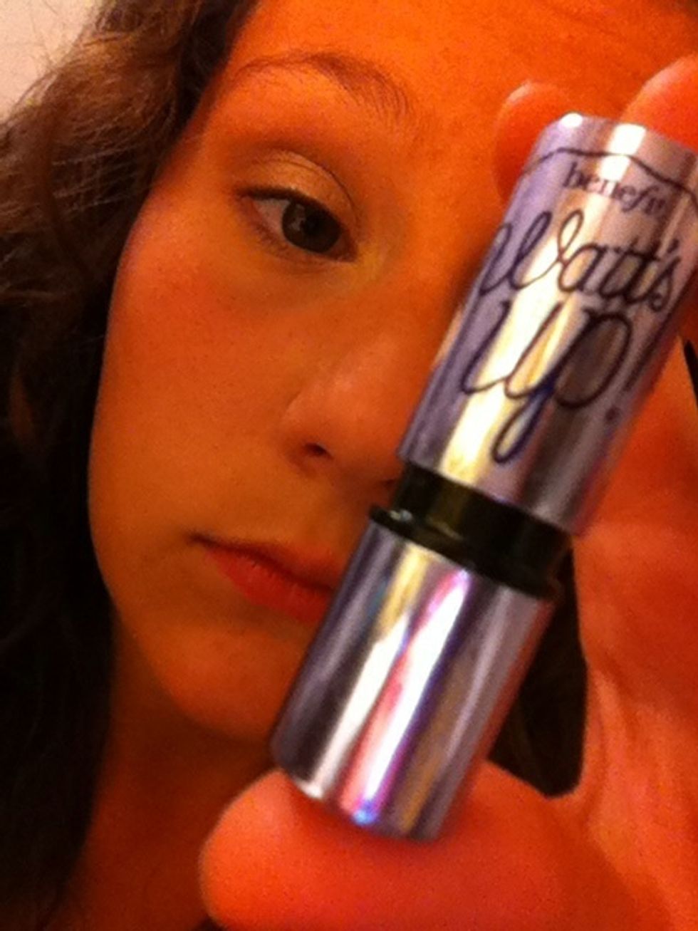 Next I put my Benefit Cosmetics Watts Up highlighter and put it right under my eyebrow.