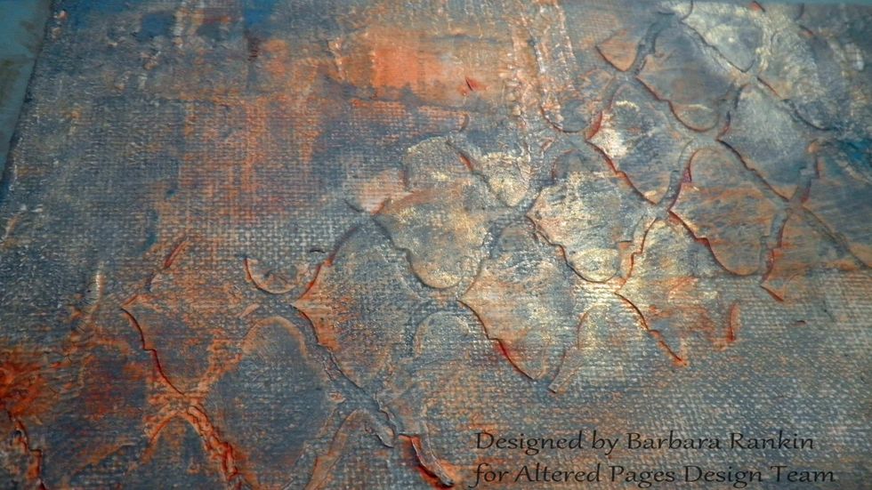 Next, I randomly added DecoArt Interference Gold, concentrating on the darker areas. Because it is an interference paint, it needs to have a darker background to reflect the light.