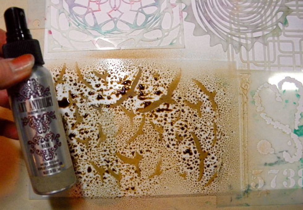 Next I sprayed Warm on the Take Flight stencil.