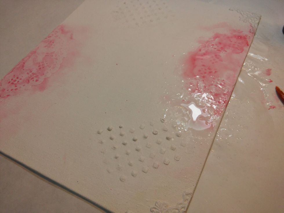 Next I spritzed them with a couple sprays of water. It waters down the paint, but lets it settle in the holes in the doily.