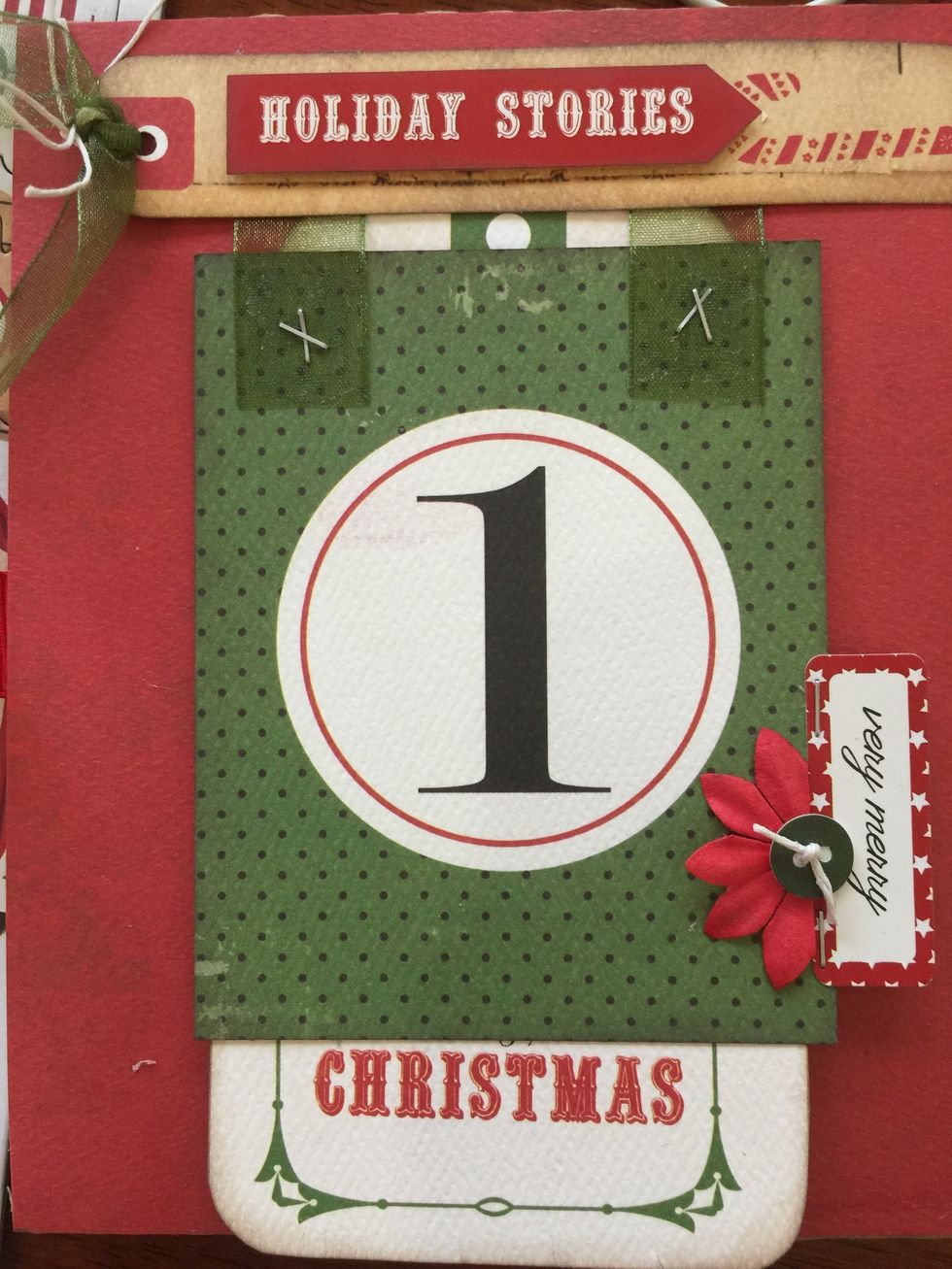 Next I started arranging the elements for each page. Adding a tag or two... Some ribbon, staples, string, flowers.....