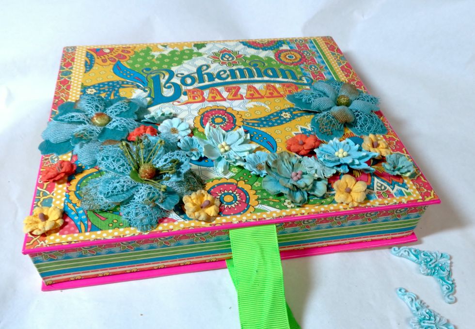 Next, I started to play with the layout of my embellishments. I always try to plan things out so that I have balance with color, as well as content.