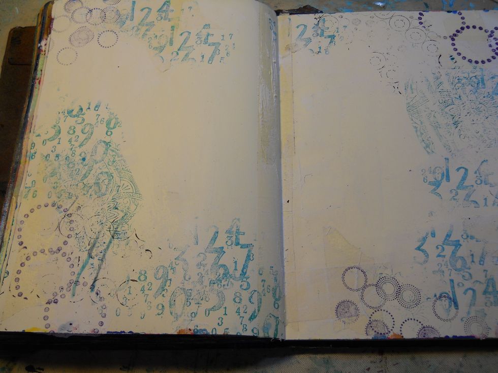 Next I used an archival ink and did some random stamping onto the background. I then used a heat tool to set the ink and prevent running.