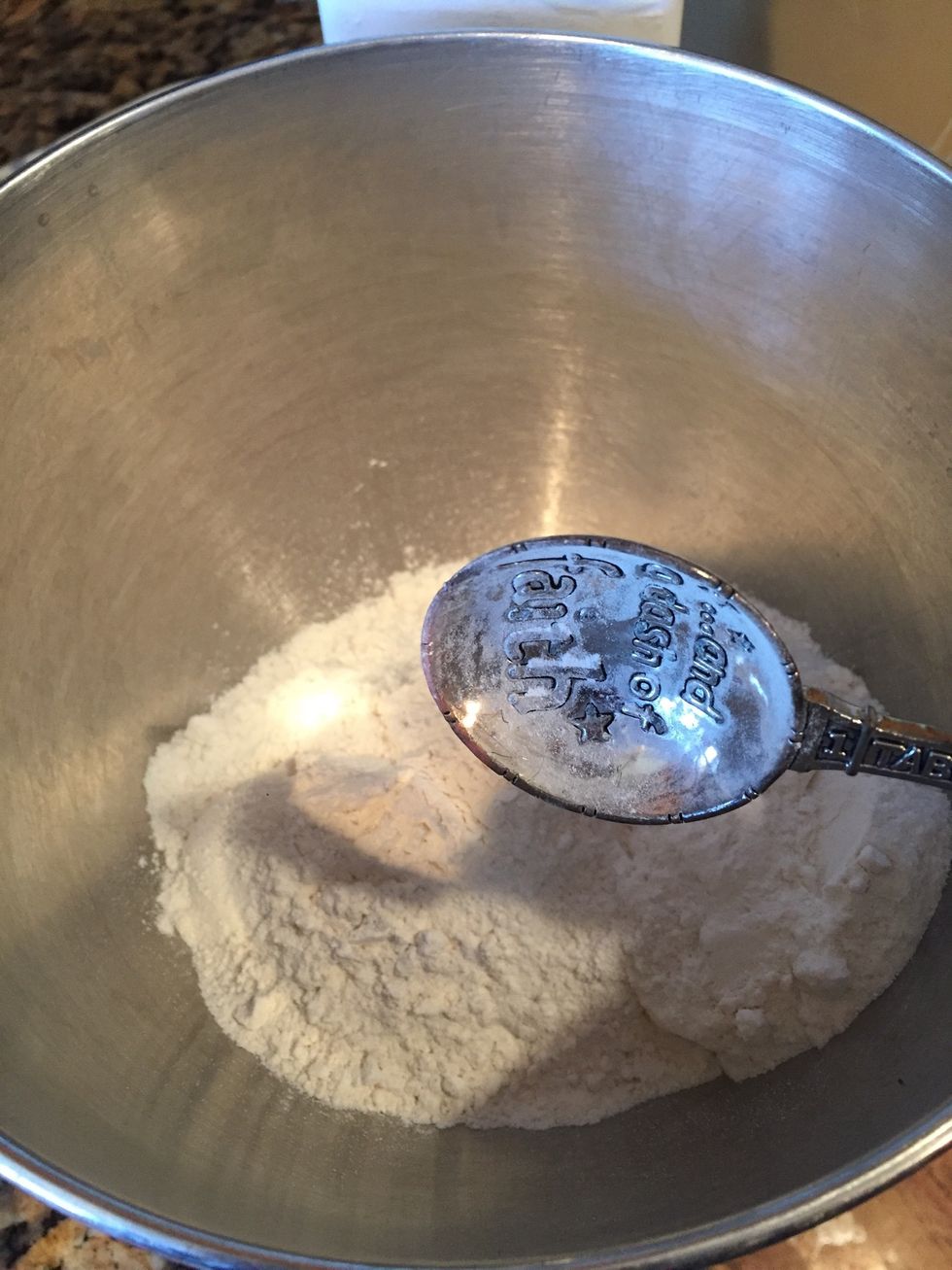 Next in a mixing bowl, one vanilla cake mix and 3 TB flour