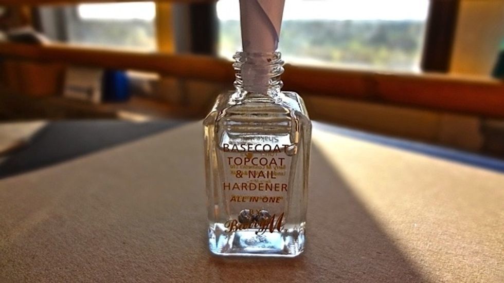 Next insert the funnel into your chosen clear varnish. IF FULL TIP SOME OUT FIRST!!! Tip : be sure to preference a varnish with ball bearings inside. This will make mixing your final result a breeze.