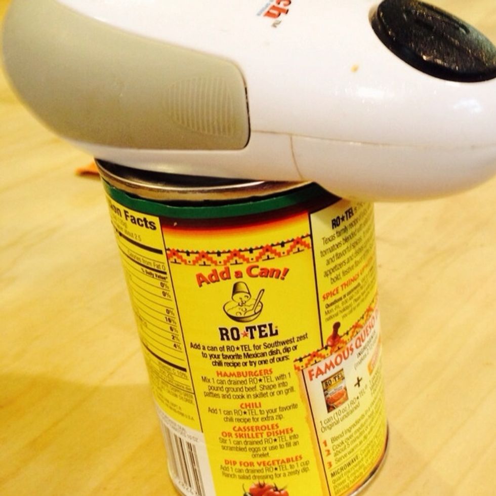 Next is the part that takes the longest.  I fight with the electric can opener to get the cans to give up their goods.  I'm blonde so it isn't an easy feat for me.  I sold my soul to it this time.