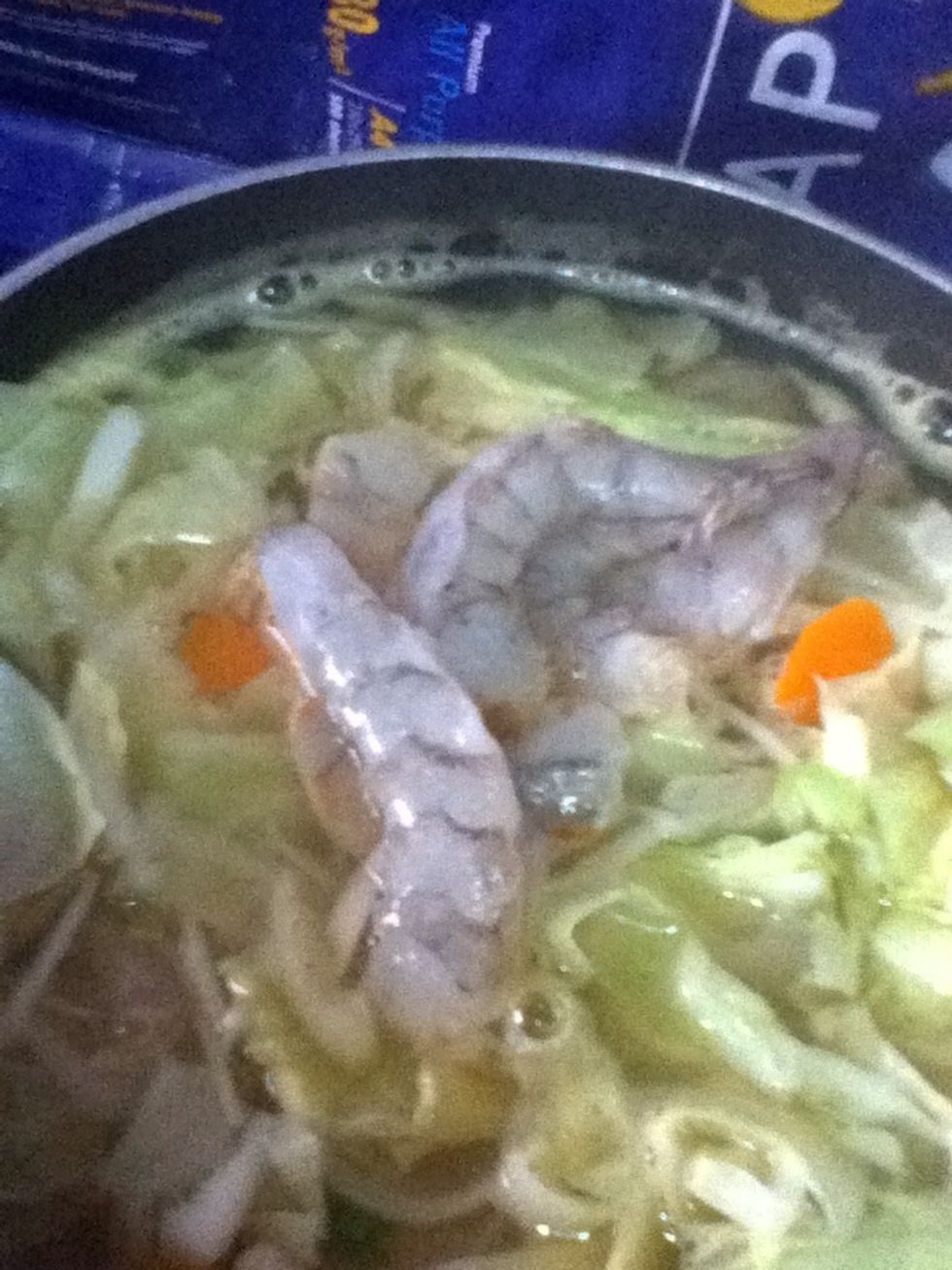 Next is the prawns. I removed the shells and the head. And yeah, remove the black string from the prawn too. :) You could add seafood too like clams, fish. Experiment it! ;)