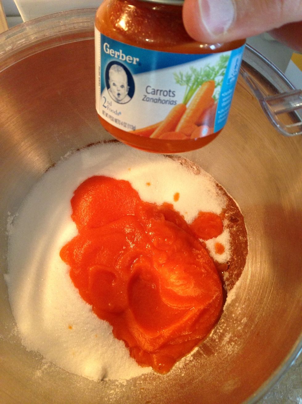Next is to add the carrot baby food. You can mix the dry ingredients 1st, but I like to add moisture to my baking to catch the dust while you stir with the electric or hand mixer.
