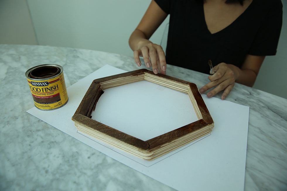 Next it's time to stain. We used a wood finish stain in the shade "English Chestnut" to get an earthy brown hue. But feel free to go darker, lighter or even experiment with a bold color like red.