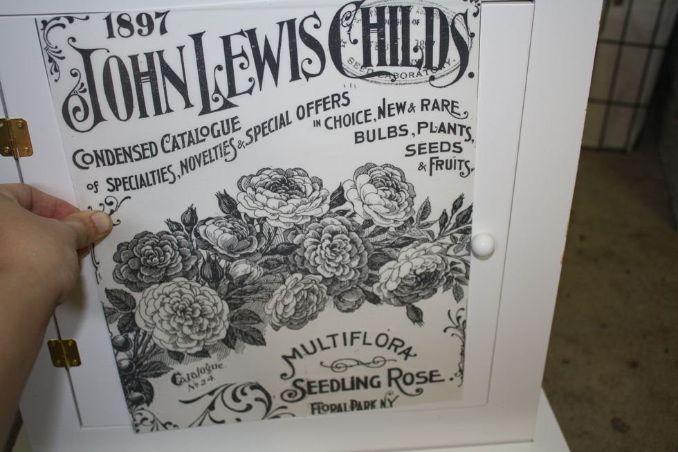 Next just hold the transfer up to the cabinet front, with the backing still on, to make sure the placement is correct and that nothing else needs to be trimmed! Looks good to me!