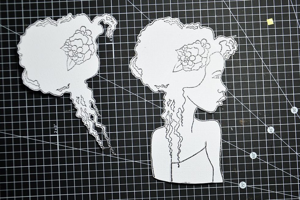 Next layer the small dress piece. You will have to double up on your dimensional dots to create the layer.