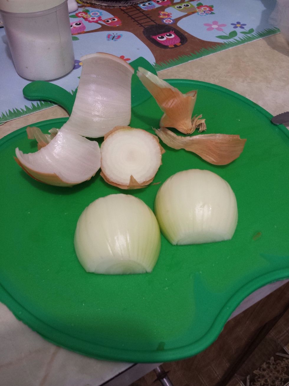 Next let's start with the onions. You can put goggles on or whatever your weird thing is to prevent from crying. Peel off the outer skin of the onion and the first layer.