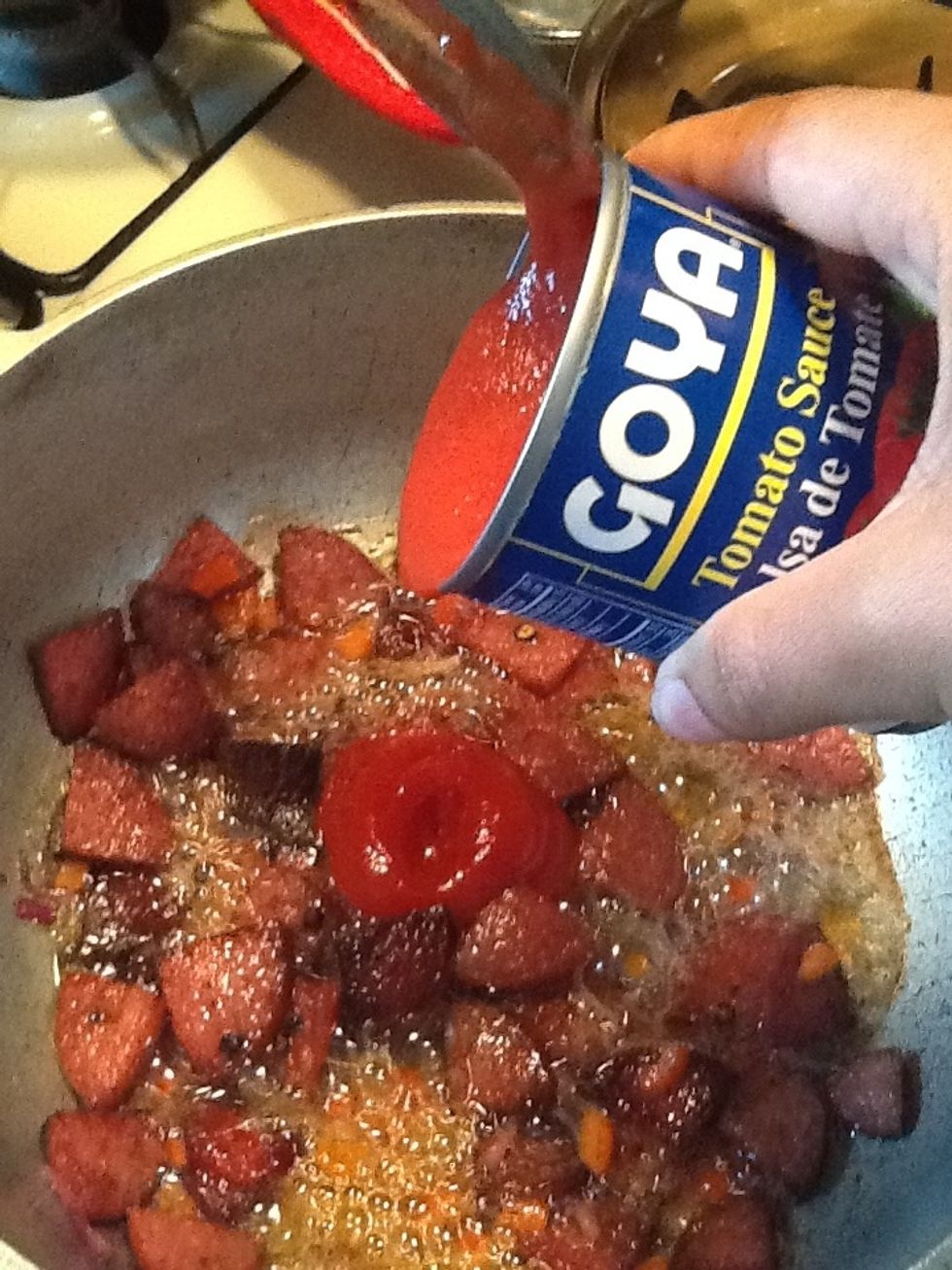 Next lets add the tomato sauce. I use Goya but feel free to use any brand of tomato sauce. Dont discard the empty can just yet. Set aside.